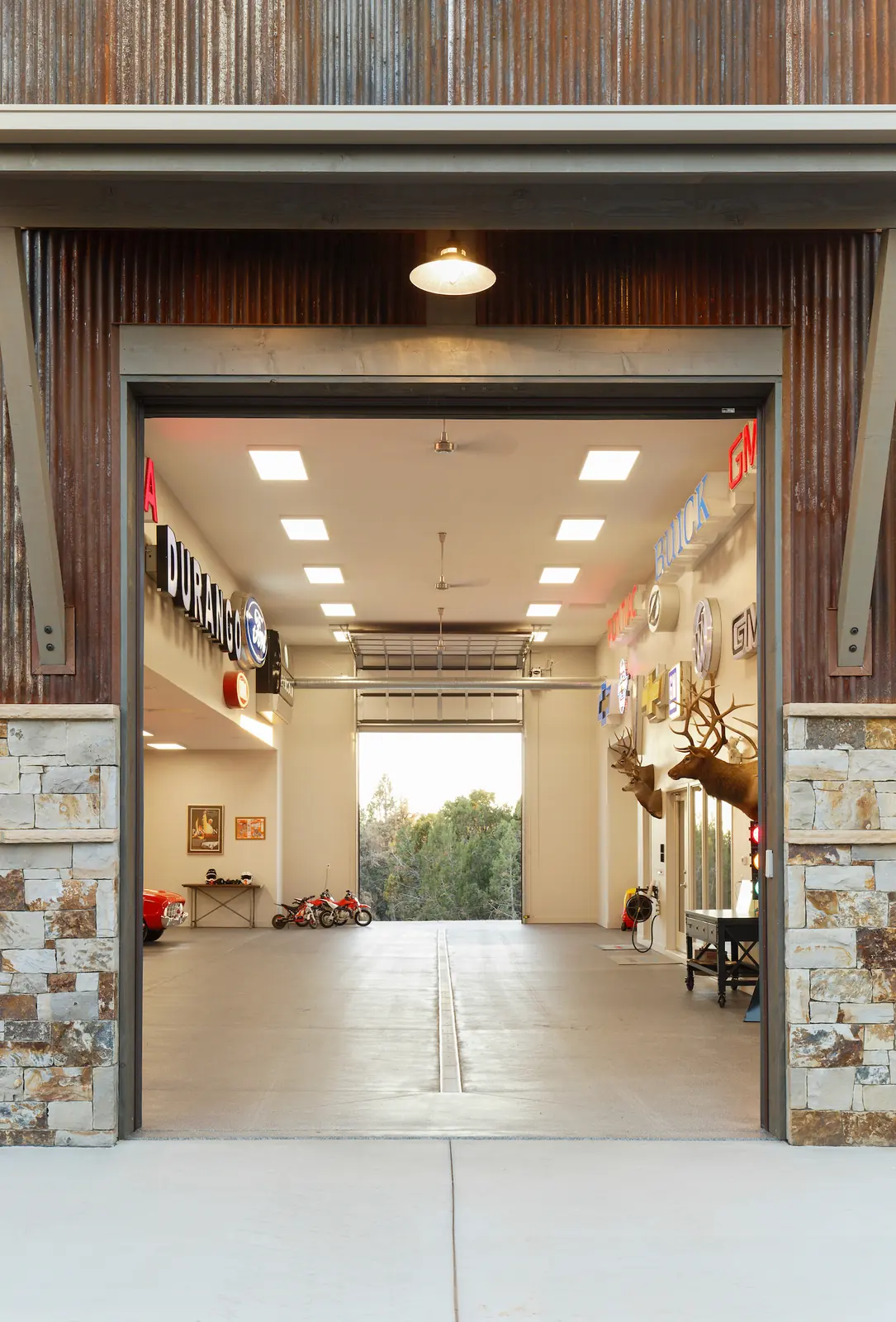 Open overhead doors looking into the collector garage, Glorified Garage, Refined Designs by Natalie