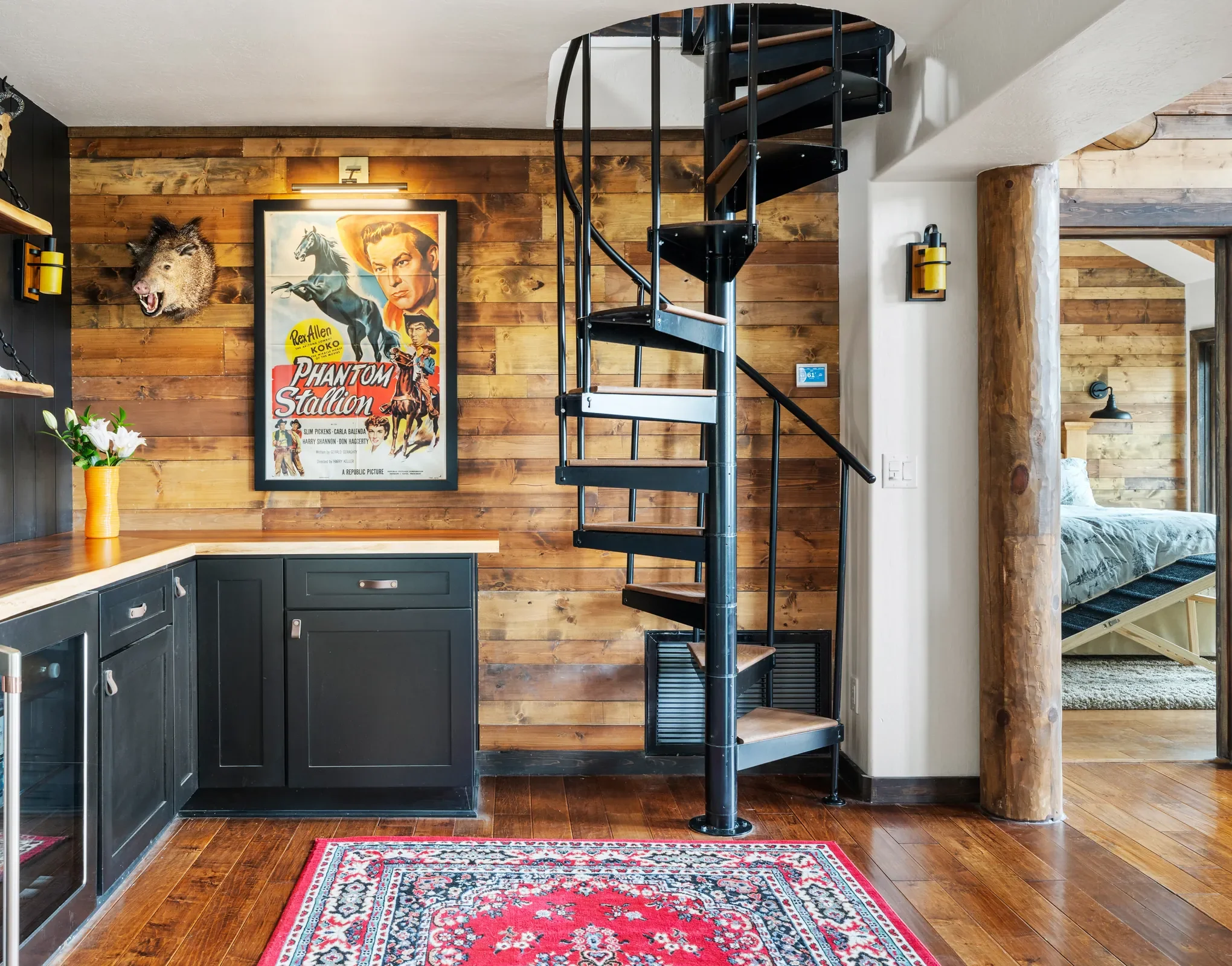 Bar and spiral staircase in the remodeled cabin, Daybreak at Ponderosa, Refined Designs by Natalie