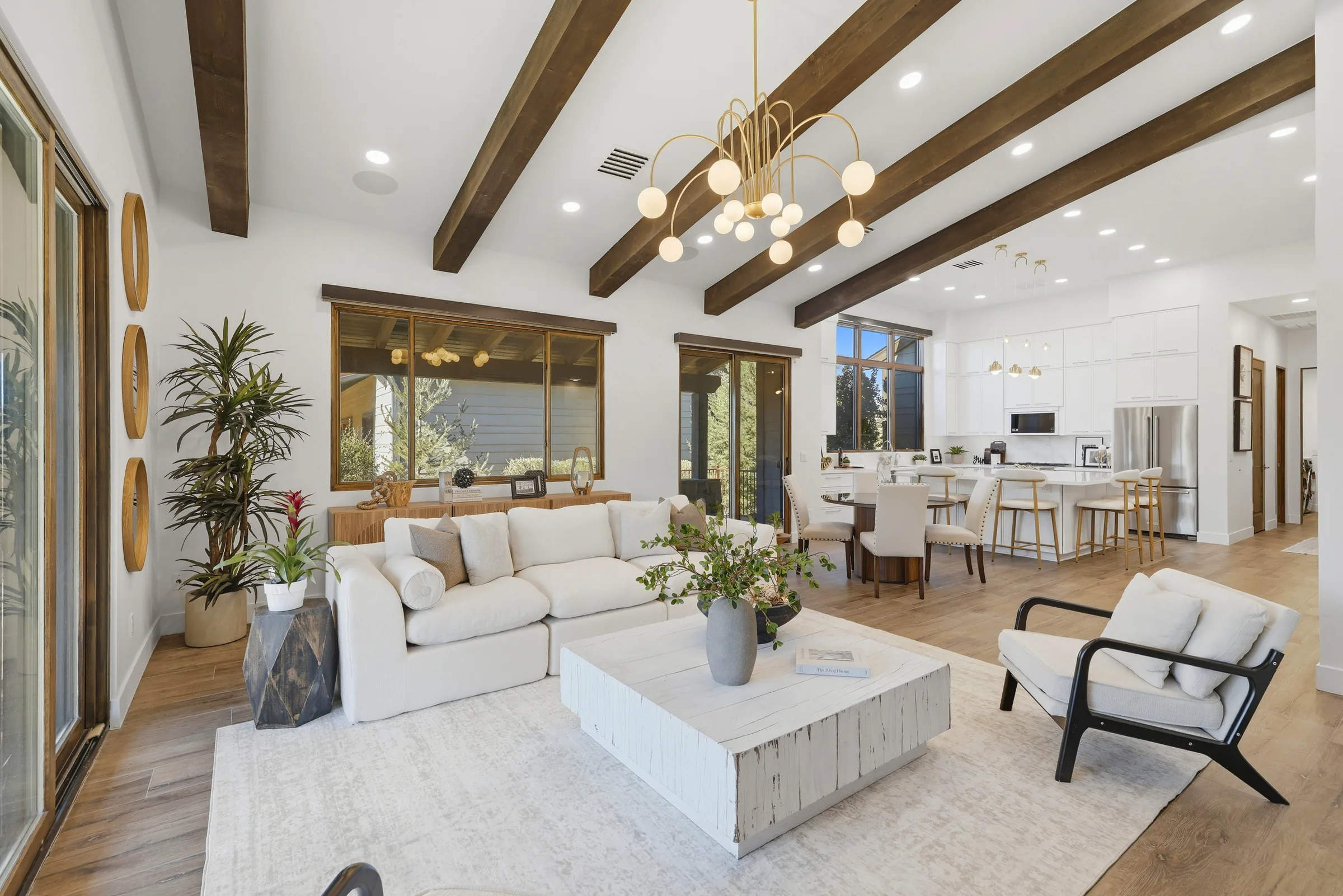 Great room with soaring ceilings and satin brass chandelier, The Modern Ranch Revival, Refined Designs by Natalie, Prescott, Arizona