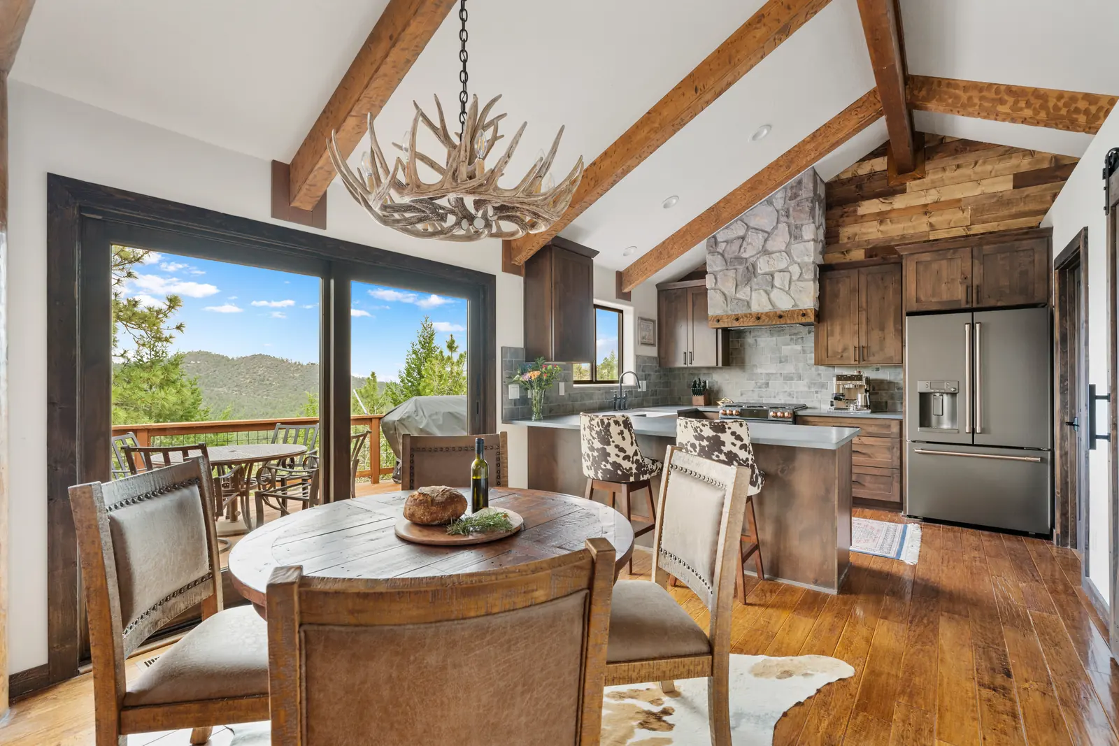Dining area open to the remodeled kitchen, Daybreak at Ponderosa, Refined Designs by Natalie
