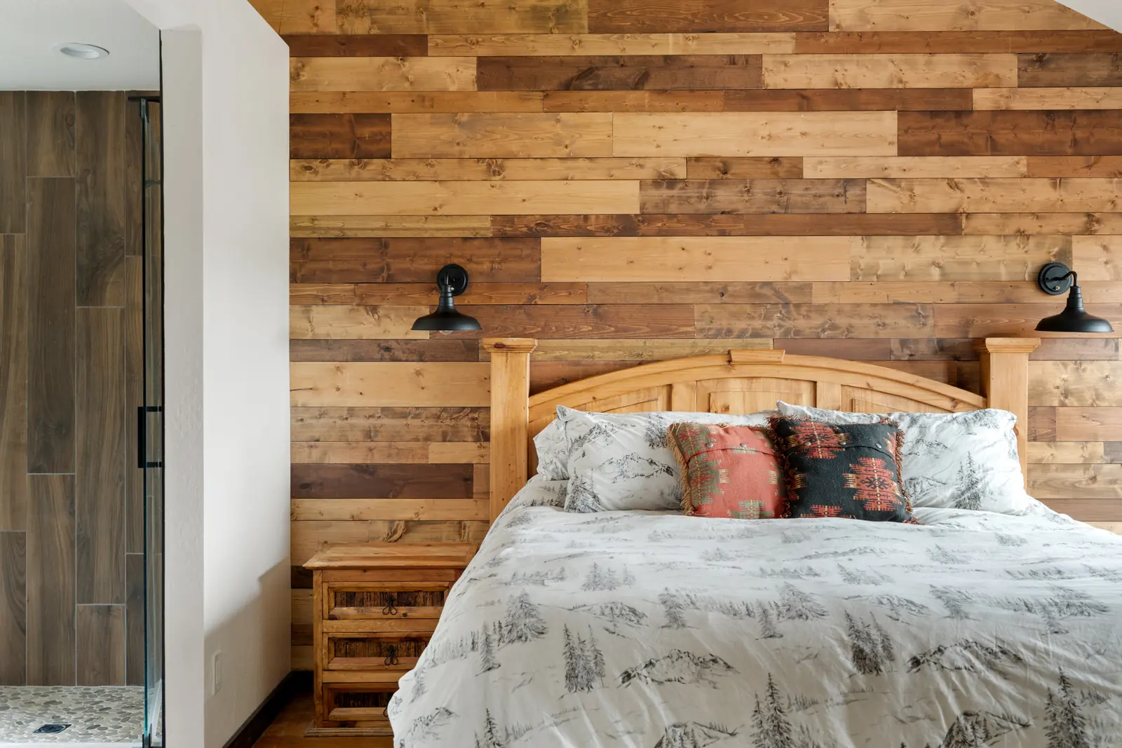 Primary bedroom in the remodeled cabin, Daybreak at Ponderosa, Refined Designs by Natalie