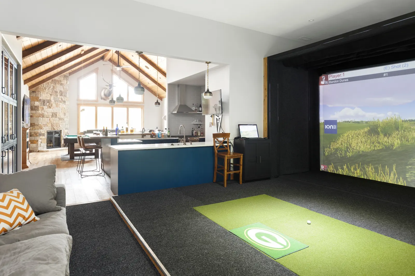 Golf simulator in the living side of the building, Glorified Garage, Refined Designs by Natalie