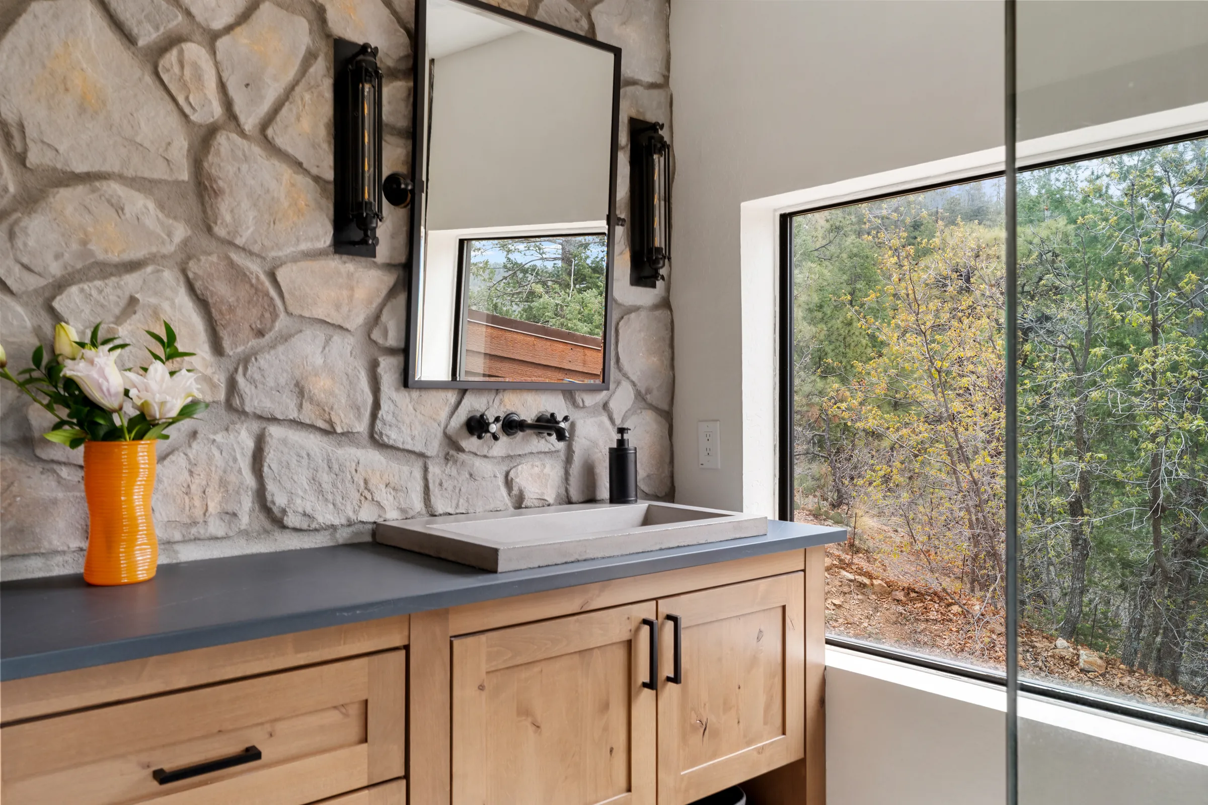 Concrete vessel sink vanity beneath a view window, Daybreak at Ponderosa, Refined Designs by Natalie