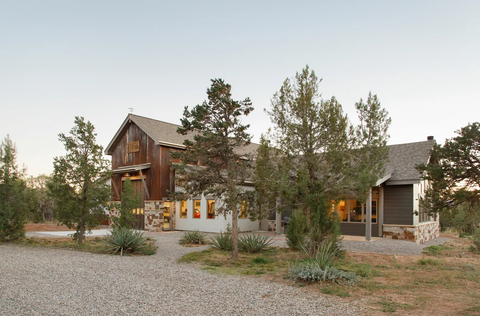 Addition and main house at dusk, Glorified Garage, Refined Designs by Natalie