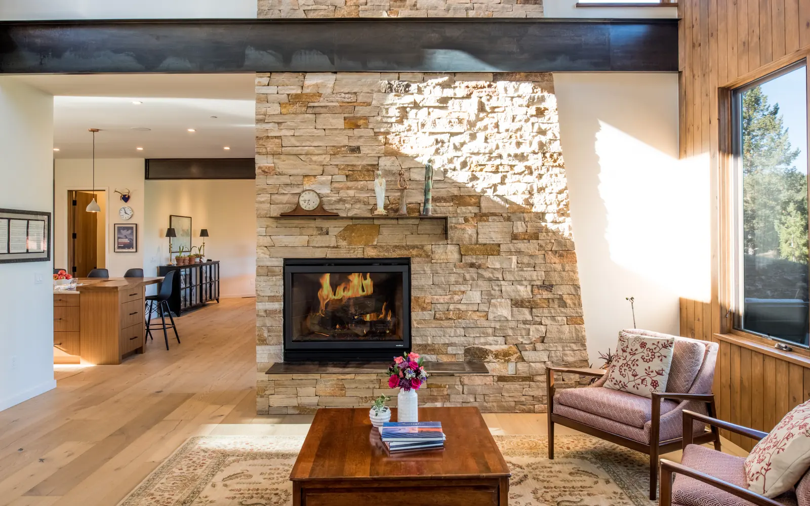 Local stone fireplace in the living room, Sophisticated Mountain Retreat, Refined Designs by Natalie