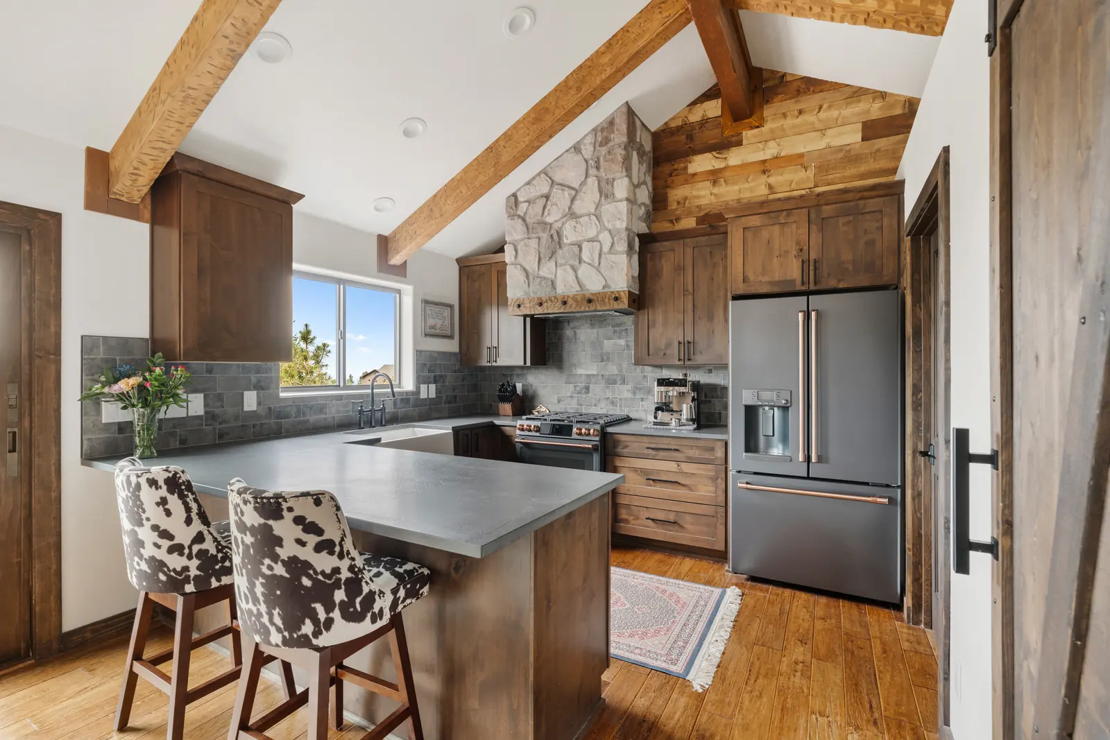 Kitchen work zone with new cabinetry set beneath original beams, Daybreak at Ponderosa, Refined Designs by Natalie