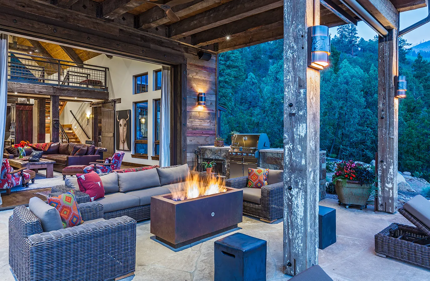 Covered patio with fire table and forest views, Rustic Mountain Retreat, Refined Designs by Natalie