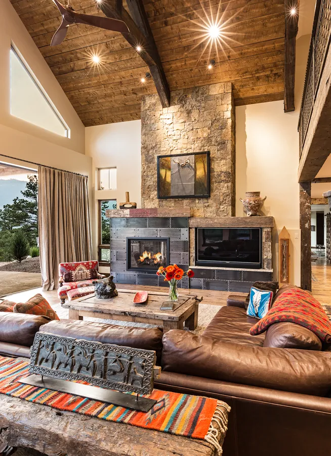 Living room with stone fireplace and timber ceiling, Rustic Mountain Retreat, Refined Designs by Natalie