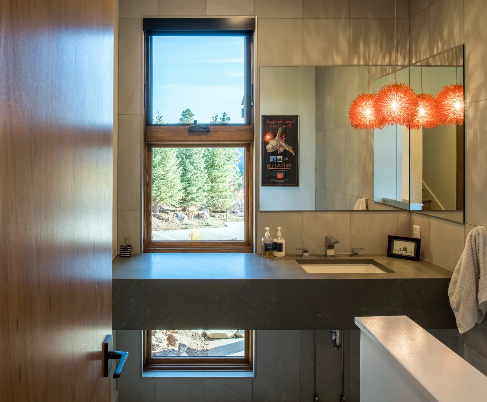 Mountain home exterior of local stone, metal and beetle-kill pine, Refined Designs by Natalie