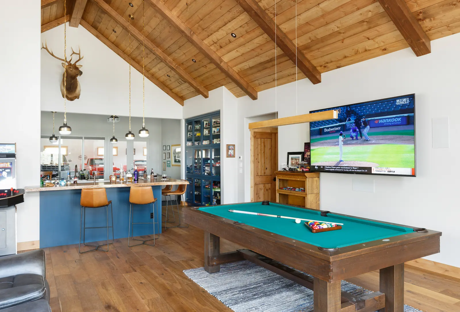 Pool table and bar seating in the living area, Glorified Garage, Refined Designs by Natalie