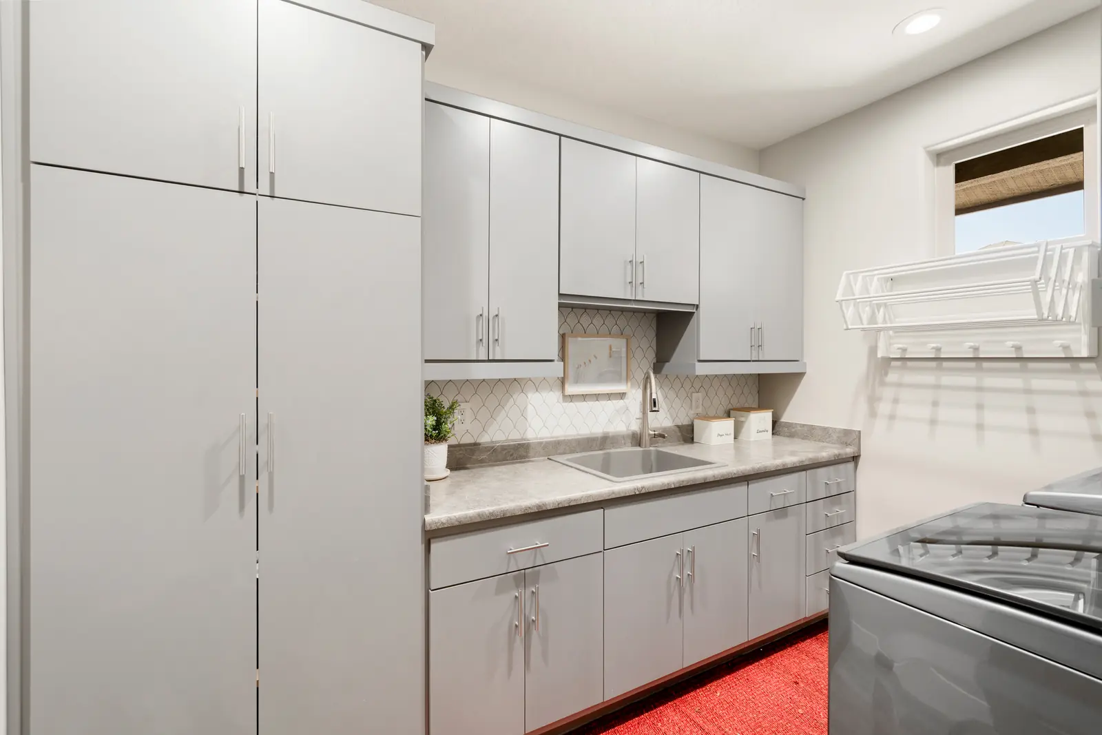 Laundry room with custom cabinetry and paneling, Layers of Romance, Refined Designs by Natalie