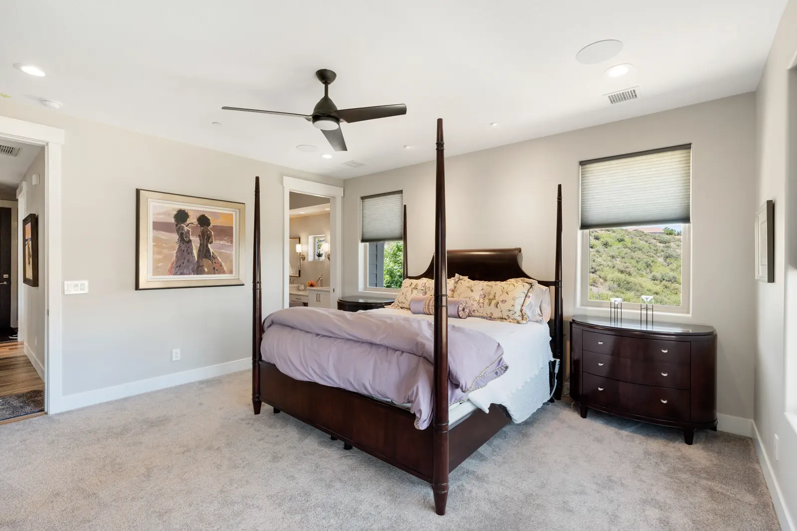 Primary bedroom with wall paneling and layered lighting, Layers of Romance, Refined Designs by Natalie